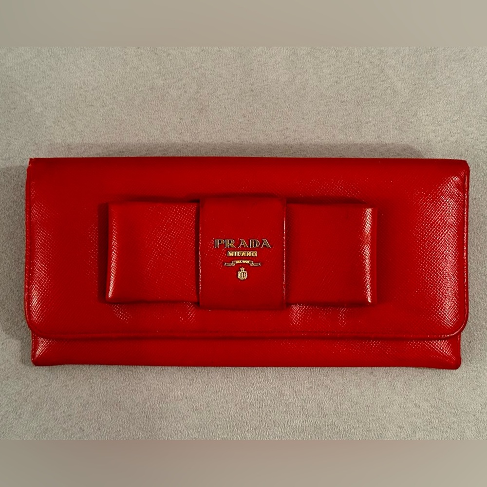 Prada Saffiano Continental Wallet. Bow snap design. Vivid red